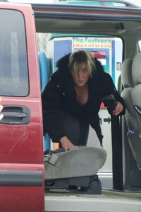Girls cleaning their cars in jeans and pants