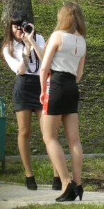 Group of Hot Girls in Blouses, Skirts and High-Heeled Shoes Photographing Each Other In a Park Creepshots