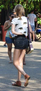 Skinny blonde chick in little denim shorts