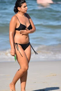 Thick mature brunette bikini lady on the beach with a nice body