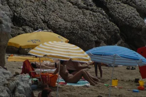 Girls on a nude beach in Sitges, Spain