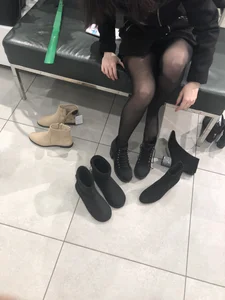 Candid teen wearing black pantyhose changing shoes creepshots