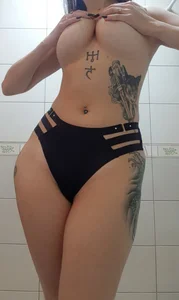 Hot Topless Girl Covering Breast With Her Hands With Tattoos in Panties Bathroom Selfies