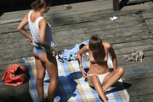 Two teens stripping and going topless to tan