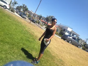 Hot brunette babe in leggings walking her dog with a nice ass and some cleavage