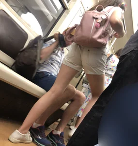 Cute Teen Girl in Shorts in Subway Train Candid Photos