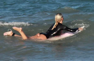 Hot surfer chicks out in the water