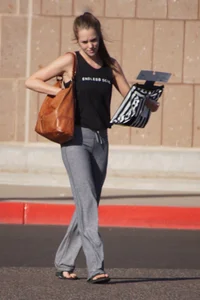 Sexy girl in the parking lot in tight grey sweatpants