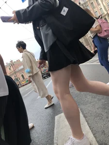Closeups of a candid girl's legs on a crosswalk