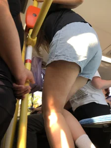 A Hot Candid Girl in Blue Denim Shorts Sitting in a Public Bus, Closeups of Her Legs And Upshorts Creepshot