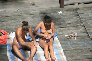 Two teens stripping and going topless to tan