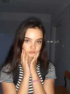 Cute Candid Skinny Teen in a Skirt Sitting in a Bus Photo