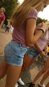 Bunch of skinny teens in shorts at the fun fair
