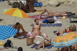 Girls on a nude beach in Sitges, Spain