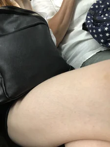 Cute candid girl with pale sexy legs sitting in subway train creepshots