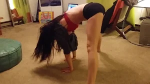 Girl in Spandex Shorts and a Top Working Out at Home Creepshot