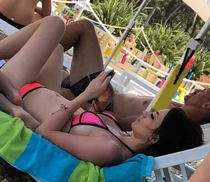 Sexy girl at the pool in pink bikini