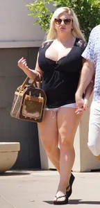 Thick blonde with big boobs in short white shorts
