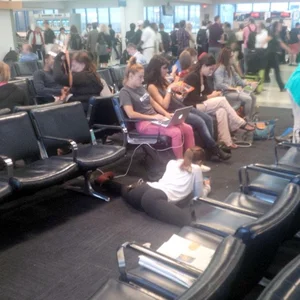 Girl in Yoga Pants Doing a Full Split at the Airport Photo