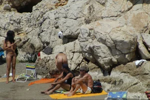 Girls on a nude beach in Sitges, Spain