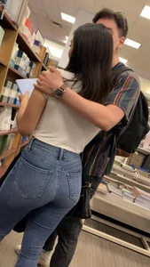 Pretty babe in tight jeans showing nipples in book store w bf (Not OC)(Face shot)
