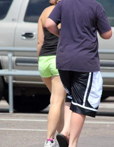 Blonde girl in glasses with a thick booty in green shorts