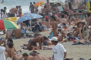 Topless girls on a beach in Barcelona