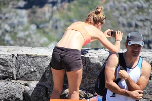 Tourist friends backpacking in shorts with vpl