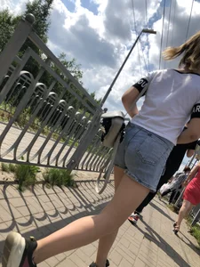 Cute Girl in Denim Shorts Walking Down a Railway Station Gallery