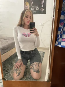 Cute tattooed girl mirror selfies in various clothes