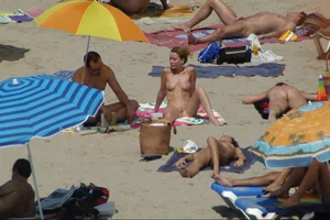 Girls on a nude beach in Sitges, Spain