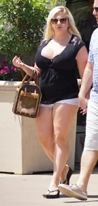 Thick blonde with big boobs in short white shorts
