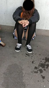 Girl With Sexy Legs in Stockings and Mini Shorts Sitting on the Ground Creepshots