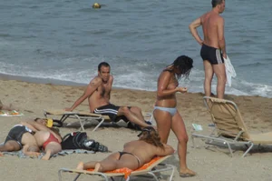 Topless girls on a beach in Barcelona