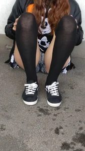 Girl With Sexy Legs in Stockings and Mini Shorts Sitting on the Ground Creepshots
