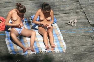 Two teens stripping and going topless to tan
