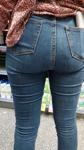 Brunette girl with nice ass sexy PAWG in tight jeans in a store