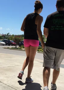 Sexy girl with a nice ass in tight pink spandex shorts