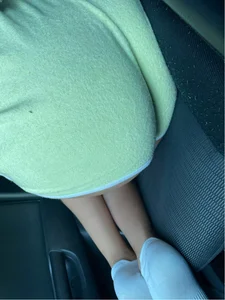 Candid Girl in Shorts And Socks Lying on the Back Seat of a Car Closeup Creepshot