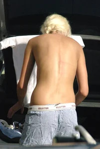 Blonde babe changing into and out of bikini and shows her tits