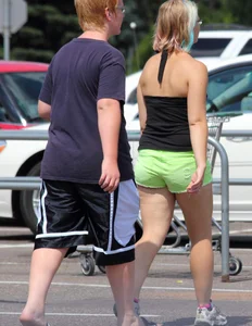 Blonde girl in glasses with a thick booty in green shorts
