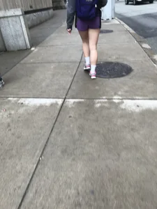 Juicy Legs of a Street Candid Girl in Shorts Creepshot