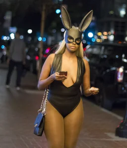 Awesome girl in a sexy outfit wearing a rabbit hat street creepshot