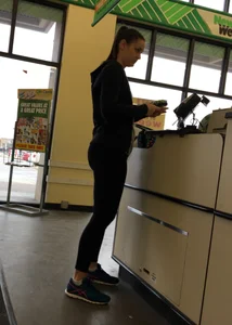 Thick booty girl shopping at Dollar Tree in leggings