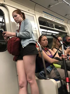 Hot Legs of a Candid Girl in Shorts Standing in a Subway Train Creepshots
