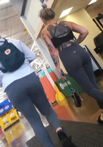 Tight ass in spandex with back Tattoo
