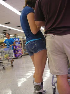 Pretty girl grocery shopping in short shorts