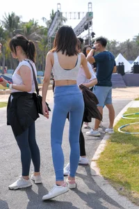 Hula hooping skinny Asian in light blue leggings with vpl