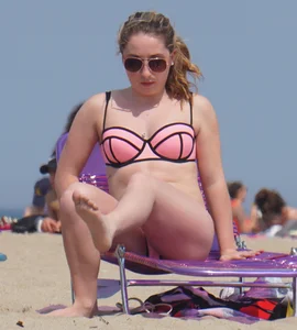 Cute babe in pink and black bikini with a bit of camel toe