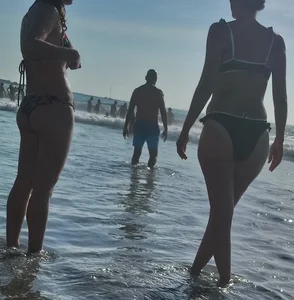 Milf with a big booty in a bikini at the beach